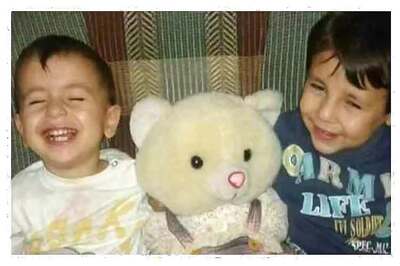 Drowned Syrian boy buried as Europe wrangles over refugees