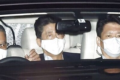 Japan PM Abe returns to office after health exam, says ready to work