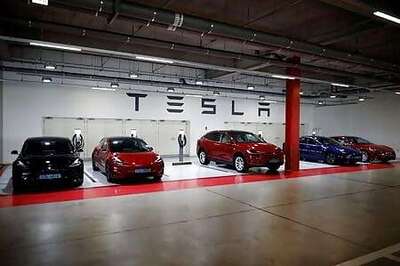Tesla sets 5-1 stock split and its high-flying stock soars again