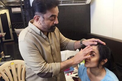 Snapshot: Kamal Haasan turns makeup man for Trisha Krishnan