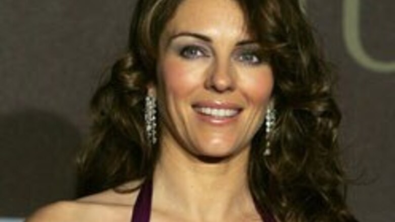Liz Hurley gets shot in swimwear