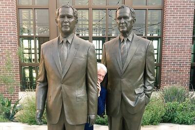 Bill Clinton is Literally Hiding Between Two Bushes in This Viral Photo