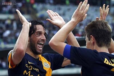 Promoted Verona shock AC Milan, Juventus win opener