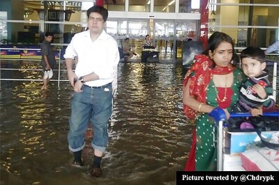 Delhi airport flooded, passengers wade through knee deep water