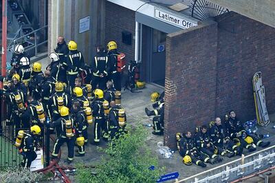 UK Firefighters Battle Blaze at Low-rise Building in East London
