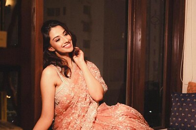 Meenaakshi Chaudhary Looks Drop-dead Gorgeous In Orange Embellished Saree