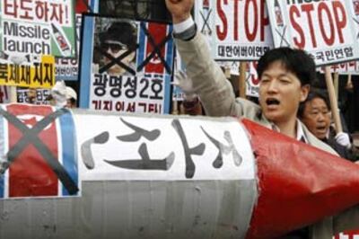 N Korea launches rocket defying world pressure |  Pics