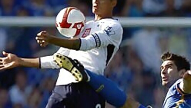 Spurs lose at Portsmouth; Man City upset by Wigan