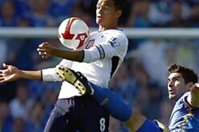 Spurs lose at Portsmouth; Man City upset by Wigan