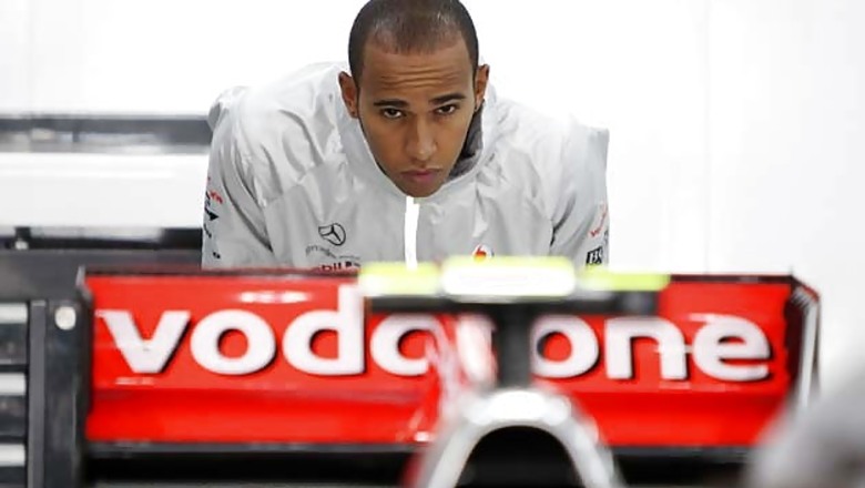 Hamilton sets pace in wet Silverstone