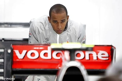 Hamilton sets pace in wet Silverstone