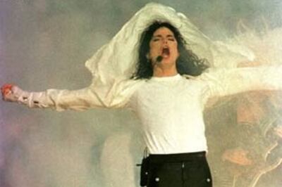 Michael Jackson buried with glove, pearls and shades