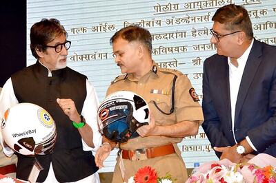 Amitabh Bachchan distributes helmets to Mumbai Traffic Police at a road safety event