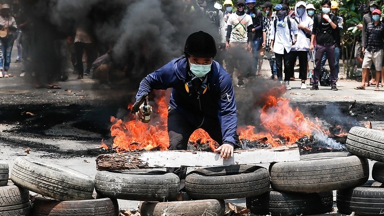 Myanmar Protesters Paint Yangon Red, Defying Bloody Army Crackdown