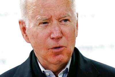 Bidens Pack Carrots, Apples Into Boxes During Food Bank Stop