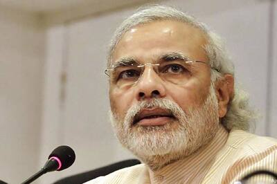 PM Modi releases commemorative 2014 FIFA World Cup postage stamps