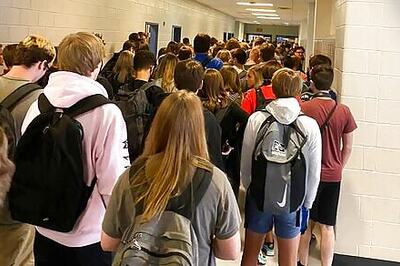 Georgia school with large crowds reports positive cases