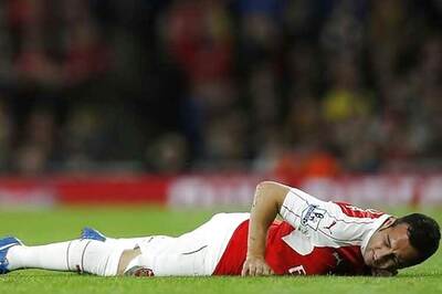 Arsenal's Cazorla out for three months after knee operation