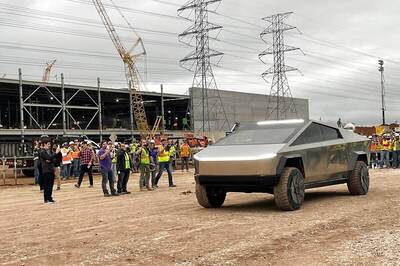 Elon Musk Drives Cybertruck EV Prototype at Upcoming Tesla Gigafactory in Texas