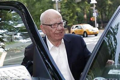 Rupert Murdoch quits boards of British papers