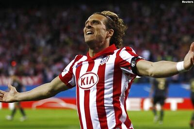 Forlan strike gives Atletico edge over Liverpool
