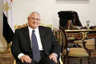 Egypt's interim government gets to work amid protests, deadlock