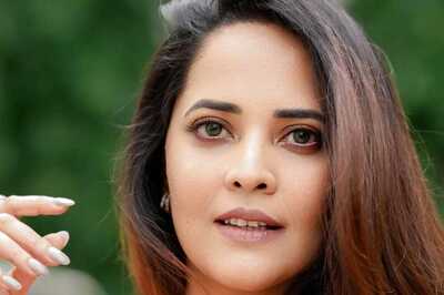 Actress Anasuya Bharadwaj Serves Fiery Look In Red Saree