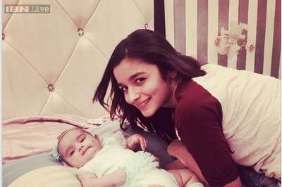 Snapshot: Alia Bhatt looks excited as she cuddles up to a baby girl