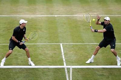 Bryan brothers win 1st-round match at Wimbledon