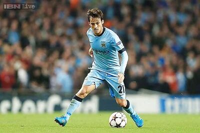 Manchester City's Silva ruled out for up to a month with knee injury