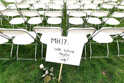 Empty Chairs Mark Protest Outside Russia's Hague Embassy as Trial Begins Over Downed Flight MH17
