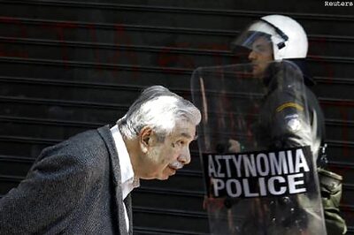 Greece downgraded, deficit worse than feared
