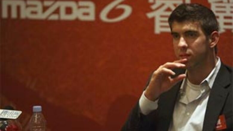 Phelps back in Beijing, models for automaker Mazda