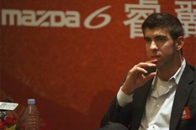 Phelps back in Beijing, models for automaker Mazda
