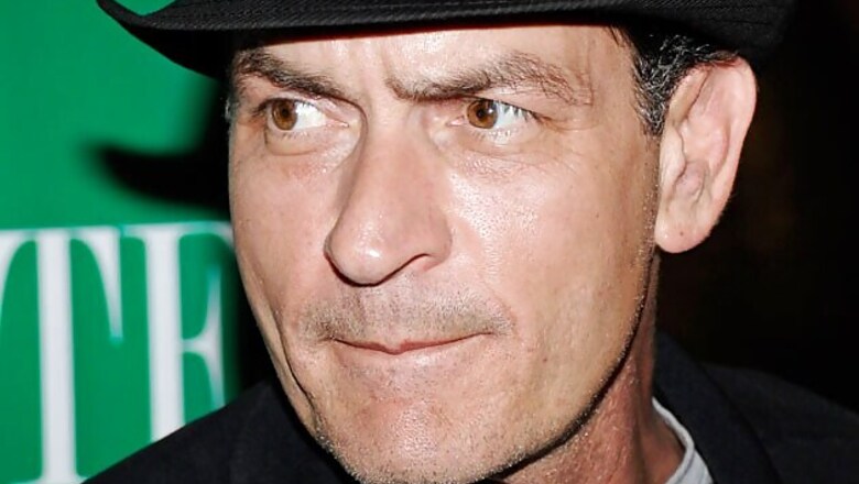 Charlie Sheen kisses adult film star Brett Rossi